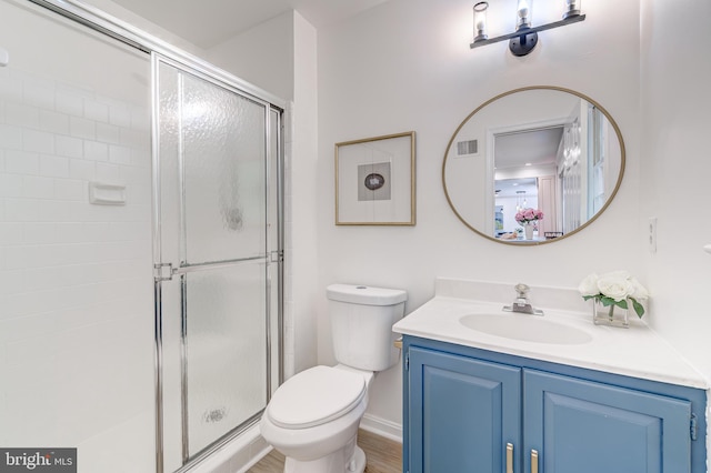 12209 Lake James Dr, Herndon, VA 20171 - bathroom featuring a shower stall, vanity, and wood finished floors