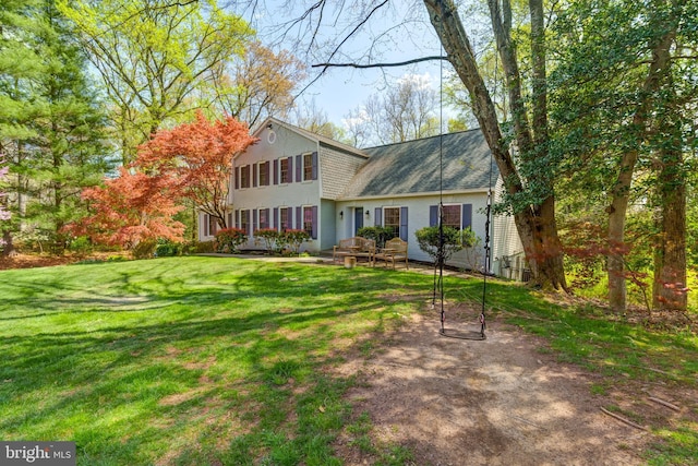 12209 Lake James Dr, Herndon, VA 20171 - view of front of home featuring stucco siding, a front lawn, and a shingled roof