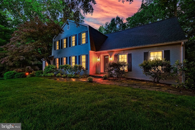 12209 Lake James Dr, Herndon, VA 20171 - view of front of property featuring a shingled roof, a lawn, and brick siding