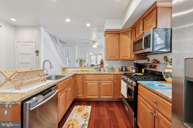 16 W Langhorne Ave, Havertown, PA 19083 - kitchen featuring stainless steel appliances, a sink, dark wood-style flooring, light stone countertops, and recessed lighting