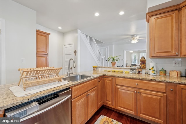 16 W Langhorne Ave, Havertown, PA 19083 - kitchen with stainless steel dishwasher, a sink, ceiling fan, dark wood-type flooring, and light stone countertops