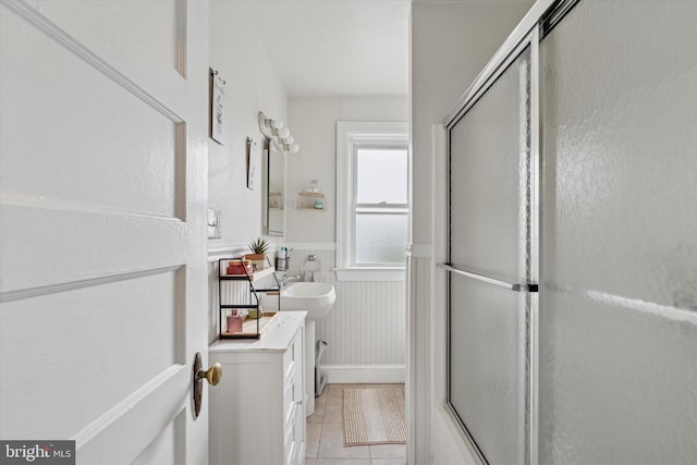 16 W Langhorne Ave, Havertown, PA 19083 - bathroom featuring tile patterned floors and a wainscoted wall