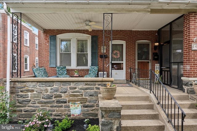 16 W Langhorne Ave, Havertown, PA 19083 - property entrance featuring a porch, brick siding, and a ceiling fan
