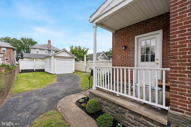 16 W Langhorne Ave, Havertown, PA 19083 - view of patio with driveway, an outbuilding, and a detached garage