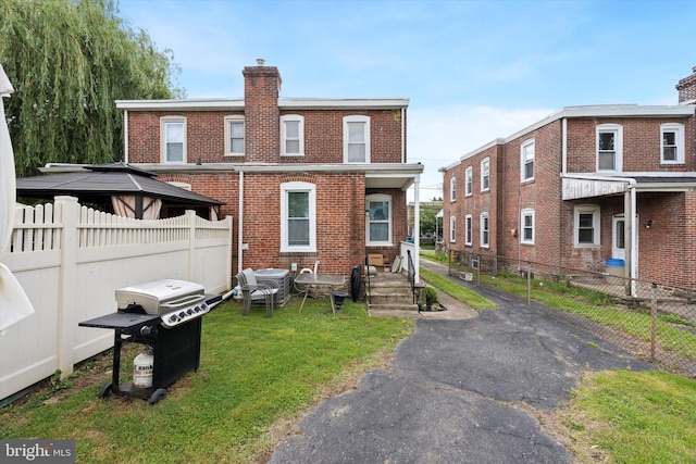 16 W Langhorne Ave, Havertown, PA 19083 - back of property with brick siding and a chimney