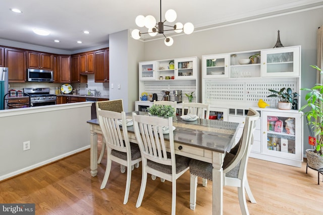 3 Wedgewood Ct, Princeton, NJ 08540 - dining room with a chandelier, light wood-style flooring, recessed lighting, and crown molding