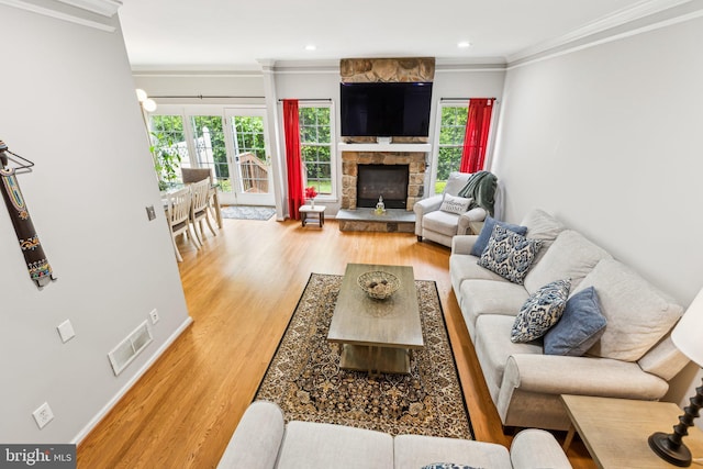 3 Wedgewood Ct, Princeton, NJ 08540 - living room with light wood-type flooring, crown molding, a stone fireplace, and recessed lighting