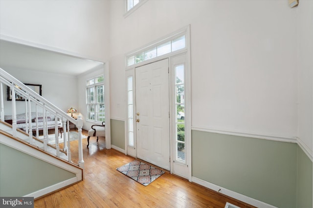 3663 Thomasson Crossing Dr, Triangle, VA 22172 - entryway with stairway, healthy amount of natural light, wood finished floors, and a high ceiling
