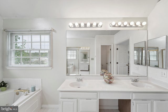 3663 Thomasson Crossing Dr, Triangle, VA 22172 - full bath featuring healthy amount of natural light, double vanity, a jetted tub, and tile patterned flooring