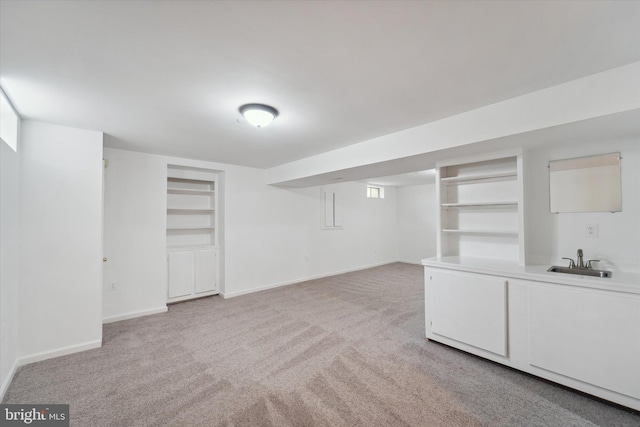 3663 Thomasson Crossing Dr, Triangle, VA 22172 - finished basement featuring light colored carpet and built in shelves