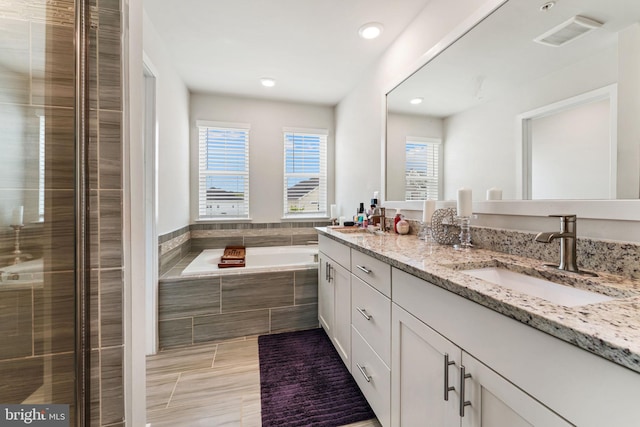 4495 Shakespeare Cir, White Plains, MD 20695 - full bath featuring double vanity, a bath, recessed lighting, a shower stall, and tile patterned floors