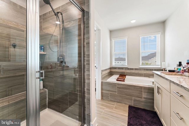 4495 Shakespeare Cir, White Plains, MD 20695 - full bathroom featuring vanity, a stall shower, and a bath