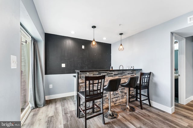 4495 Shakespeare Cir, White Plains, MD 20695 - dining space featuring wet bar, wood finished floors, and recessed lighting