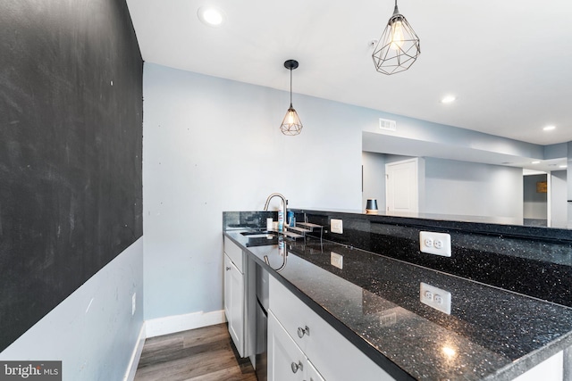 4495 Shakespeare Cir, White Plains, MD 20695 - kitchen featuring dark wood-style flooring, white cabinets, recessed lighting, dark stone countertops, and pendant lighting