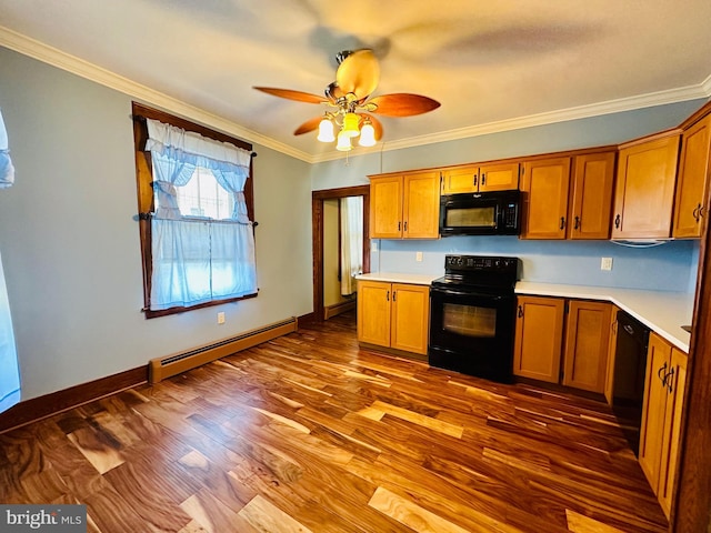 531 S 3rd St, Oakland, MD 21550 - kitchen with black appliances, baseboard heating, light countertops, ornamental molding, and a ceiling fan