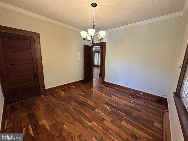 531 S 3rd St, Oakland, MD 21550 - empty room featuring dark wood finished floors, a chandelier, crown molding, and baseboards