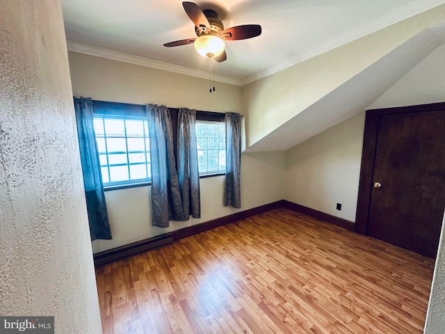 531 S 3rd St, Oakland, MD 21550 - additional living space with wood finished floors, ceiling fan, a baseboard heating unit, and baseboards