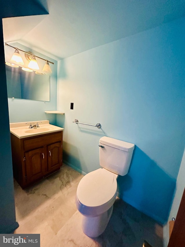 531 S 3rd St, Oakland, MD 21550 - half bath with vanity, toilet, baseboards, and lofted ceiling