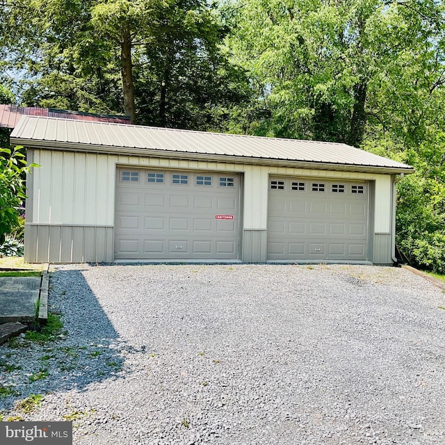 531 S 3rd St, Oakland, MD 21550 - detached garage featuring view of wooded area