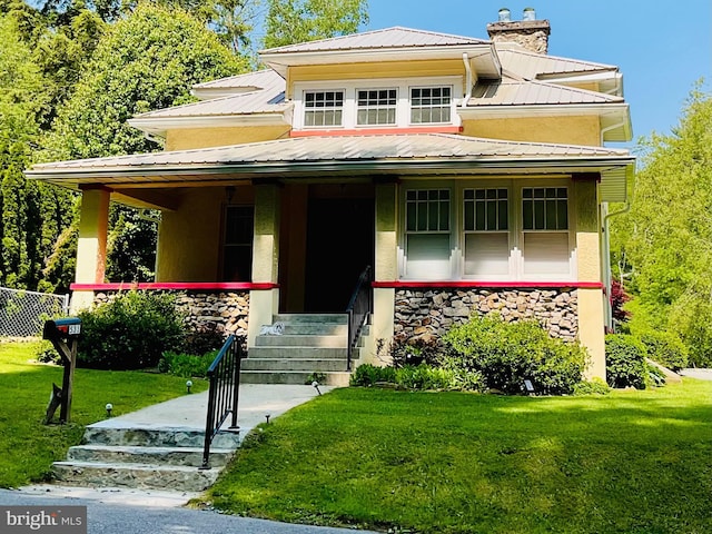 531 S 3rd St, Oakland, MD 21550 - view of front of home featuring covered porch, a front lawn, a chimney, and metal roof