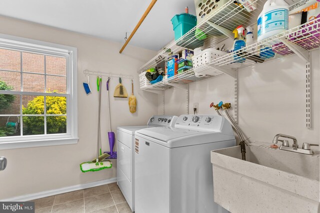 9824 Whetstone Dr, Montgomery Village, MD 20886 - washroom with independent washer and dryer, plenty of natural light, baseboards, and light tile patterned floors