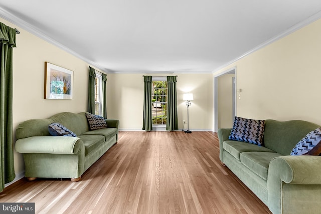 9824 Whetstone Dr, Montgomery Village, MD 20886 - living room featuring light wood finished floors, crown molding, and baseboards