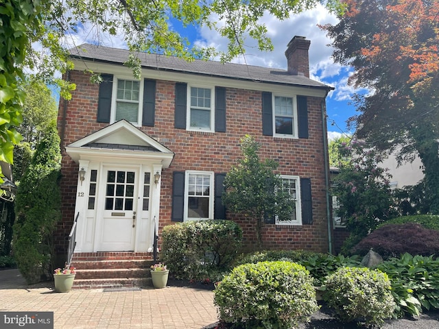12 Sergeant St, Princeton, NJ 08540 - view of front of house with entry steps, a chimney, and brick siding