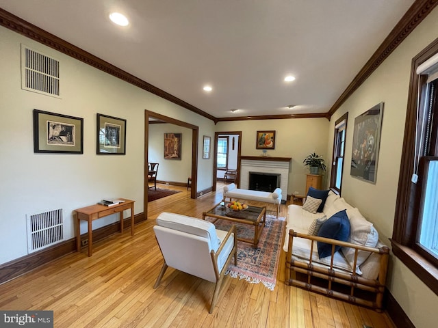 12 Sergeant St, Princeton, NJ 08540 - living area featuring light wood finished floors, baseboards, recessed lighting, crown molding, and a brick fireplace
