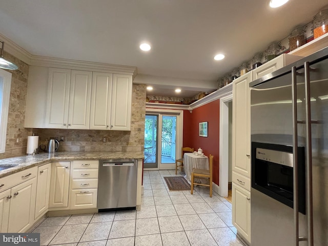 12 Sergeant St, Princeton, NJ 08540 - kitchen with appliances with stainless steel finishes, light tile patterned floors, backsplash, light stone countertops, and recessed lighting