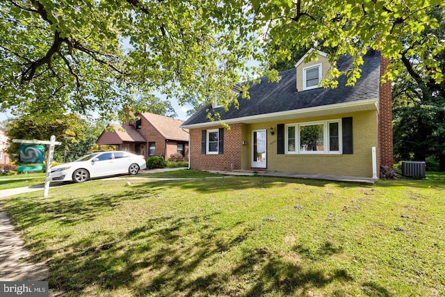 6005 Westwood Ave, Baltimore, MD 21206 - cape cod-style house with central air condition unit, brick siding, and a front lawn