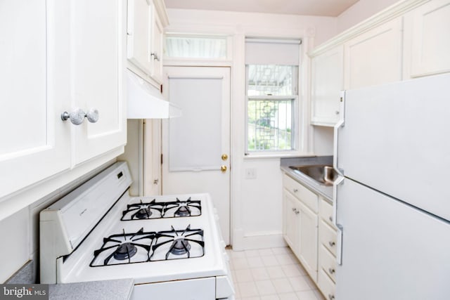 1432 C St SE, Washington, DC 20003 - kitchen featuring white appliances, white cabinets, light countertops, and under cabinet range hood