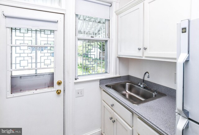 1432 C St SE, Washington, DC 20003 - kitchen with freestanding refrigerator and white cabinetry