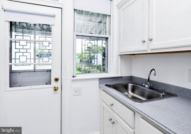 1432 C St SE, Washington, DC 20003 - kitchen featuring a sink and white cabinetry