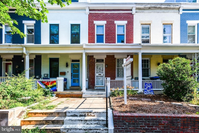 1432 C St SE, Washington, DC 20003 - townhome / multi-family property featuring brick siding and a porch