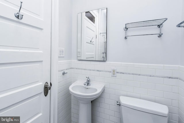 1432 C St SE, Washington, DC 20003 - bathroom with wainscoting and tile walls