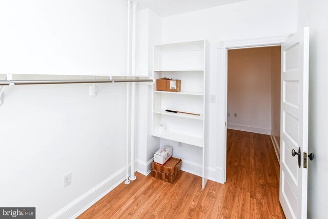 1432 C St SE, Washington, DC 20003 - walk in closet with light wood-style flooring