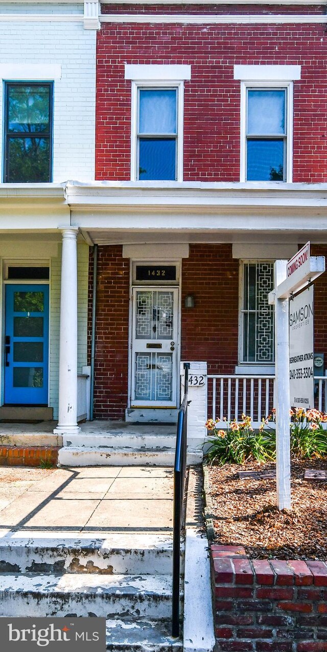 1432 C St SE, Washington, DC 20003 - doorway to property with brick siding and covered porch