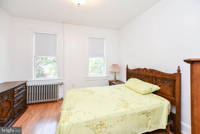 1432 C St SE, Washington, DC 20003 - bedroom with radiator and wood finished floors