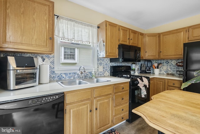 583 Upland St, Pottstown, PA 19464 - kitchen featuring black appliances, a sink, light countertops, and tasteful backsplash