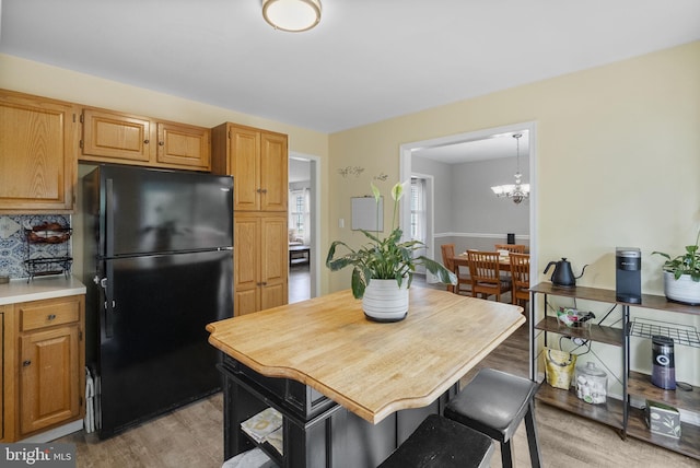 583 Upland St, Pottstown, PA 19464 - dining space with light wood-type flooring and a chandelier