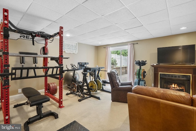 583 Upland St, Pottstown, PA 19464 - exercise area with a paneled ceiling, carpet, a glass covered fireplace, and recessed lighting