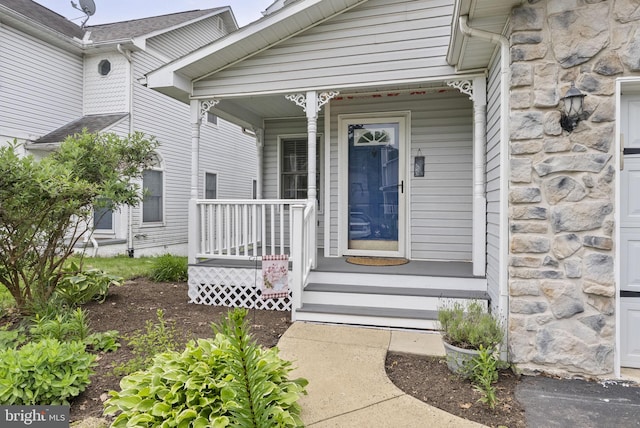 583 Upland St, Pottstown, PA 19464 - property entrance featuring a porch and stone siding