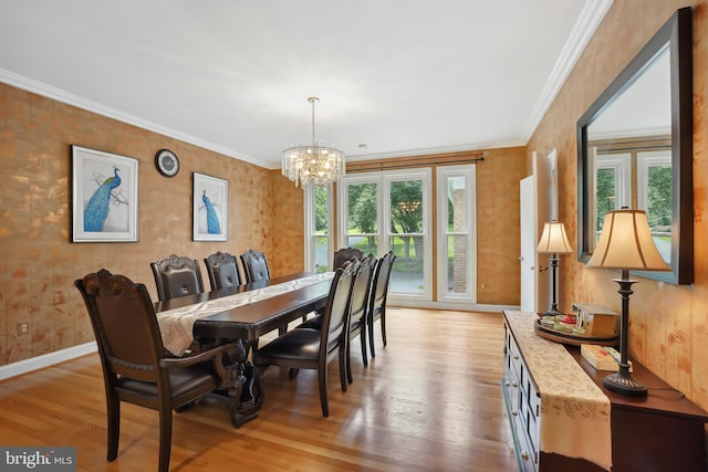12213 Lake Potomac Ter, Potomac, MD 20854 - dining area featuring plenty of natural light, a chandelier, wood finished floors, ornamental molding, and baseboards