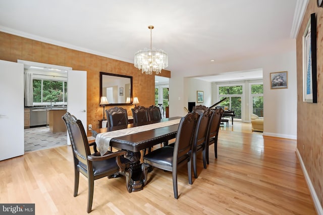 12213 Lake Potomac Ter, Potomac, MD 20854 - dining area featuring light wood-style floors, a chandelier, and baseboards