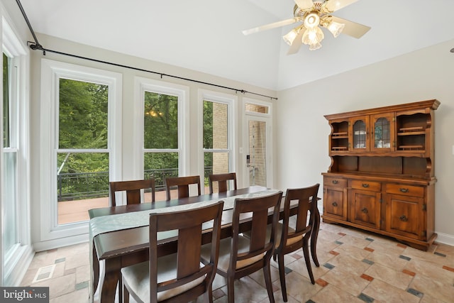 12213 Lake Potomac Ter, Potomac, MD 20854 - dining room with a ceiling fan, light stone finish flooring, and lofted ceiling