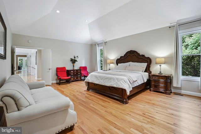 12213 Lake Potomac Ter, Potomac, MD 20854 - bedroom with lofted ceiling, multiple windows, light wood finished floors, and baseboards