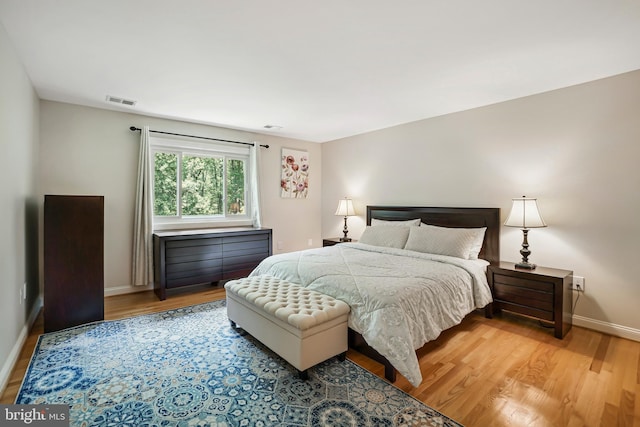 12213 Lake Potomac Ter, Potomac, MD 20854 - bedroom featuring light wood finished floors and baseboards