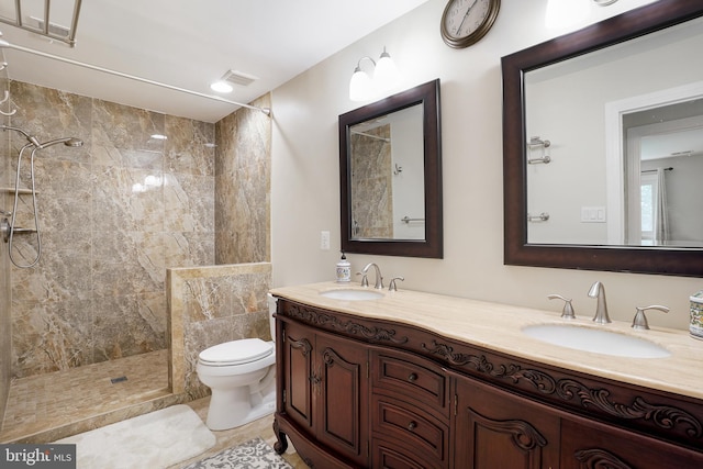 12213 Lake Potomac Ter, Potomac, MD 20854 - bathroom with tiled shower, double vanity, and toilet