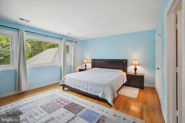 12213 Lake Potomac Ter, Potomac, MD 20854 - bedroom featuring wood finished floors and baseboards