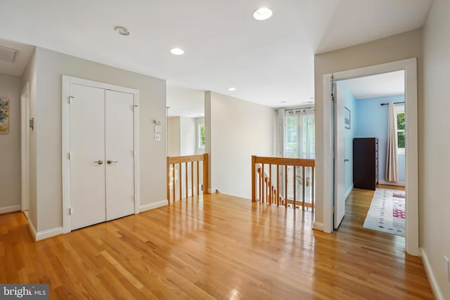 12213 Lake Potomac Ter, Potomac, MD 20854 - corridor with light wood-type flooring, an upstairs landing, baseboards, and recessed lighting